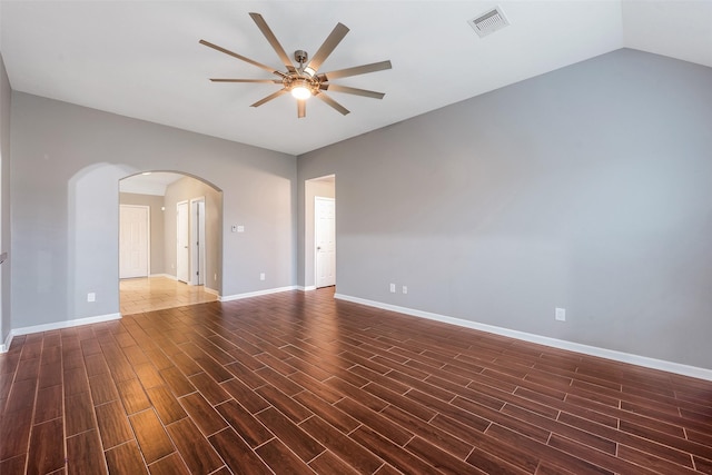 unfurnished room featuring lofted ceiling and ceiling fan