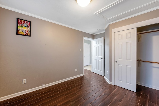 unfurnished bedroom featuring a closet and crown molding