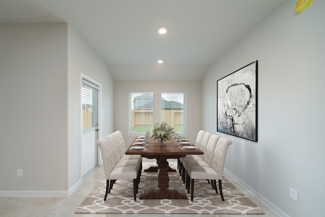 dining space featuring a wealth of natural light and lofted ceiling