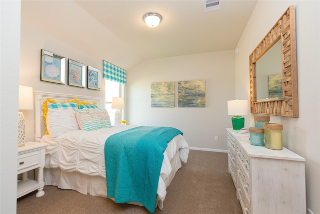 bedroom featuring lofted ceiling and carpet floors