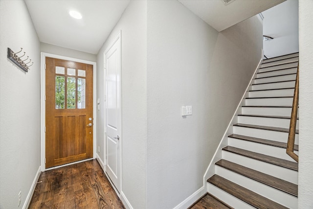 foyer entrance with dark wood-type flooring