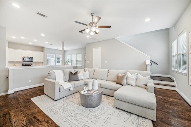 living room with ceiling fan and wood-type flooring