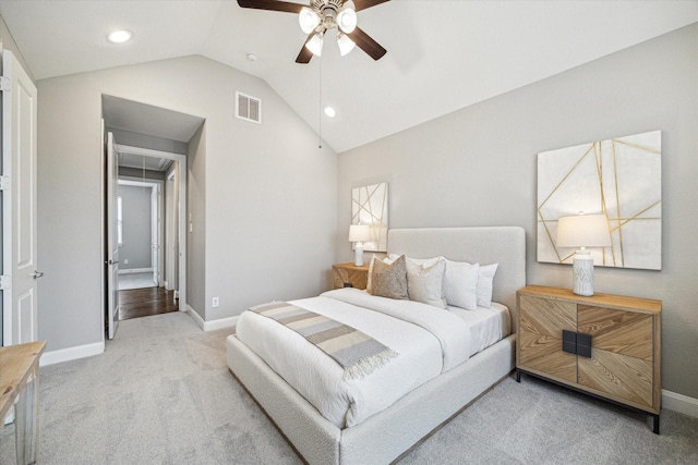 carpeted bedroom featuring lofted ceiling and ceiling fan