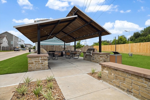 view of patio with a gazebo, an outdoor kitchen, and area for grilling