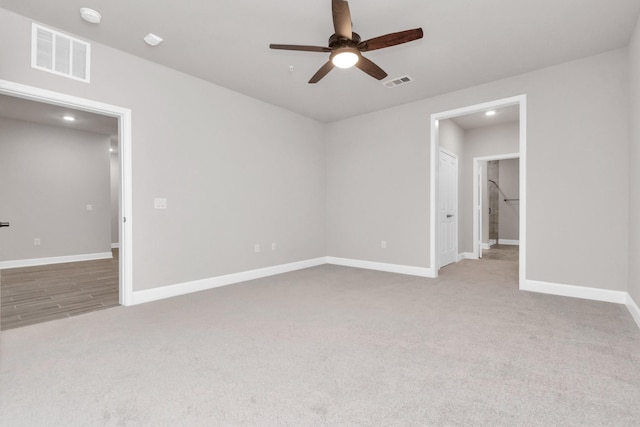 unfurnished bedroom featuring ceiling fan and carpet