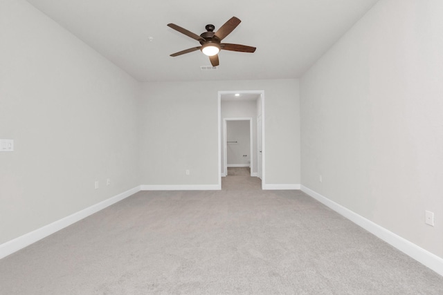 unfurnished room featuring light colored carpet and ceiling fan