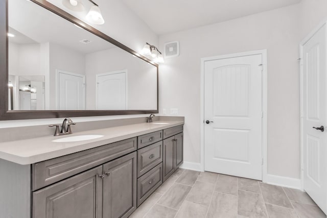 bathroom with vanity and tile patterned flooring