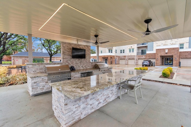 view of patio with exterior kitchen, grilling area, and ceiling fan