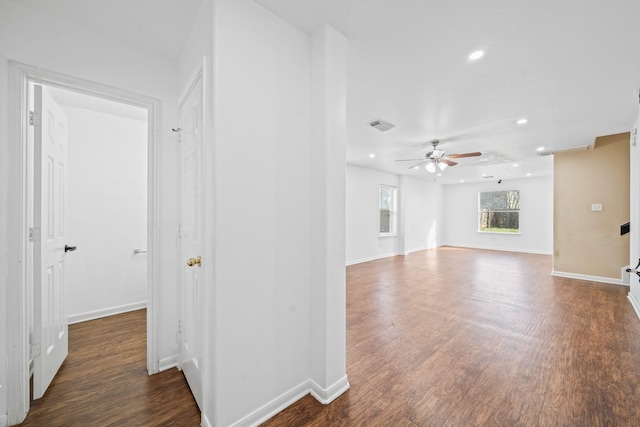 interior space with ceiling fan and dark wood-type flooring