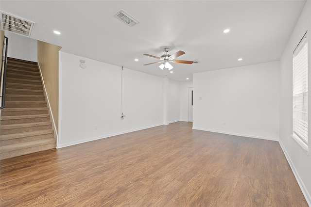 spare room featuring ceiling fan and hardwood / wood-style flooring