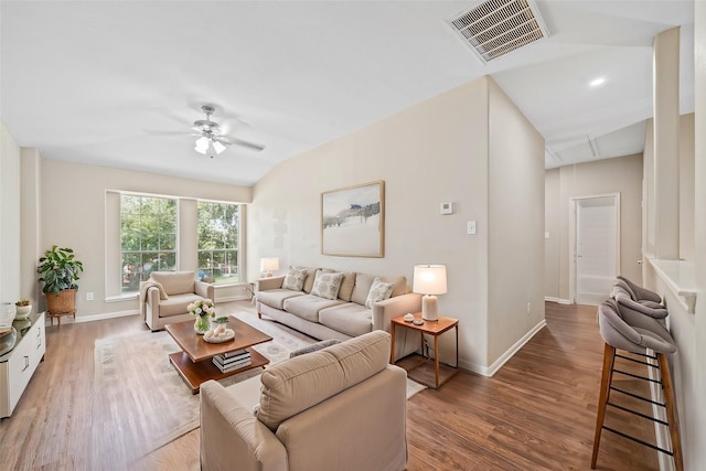 living room with ceiling fan and hardwood / wood-style floors