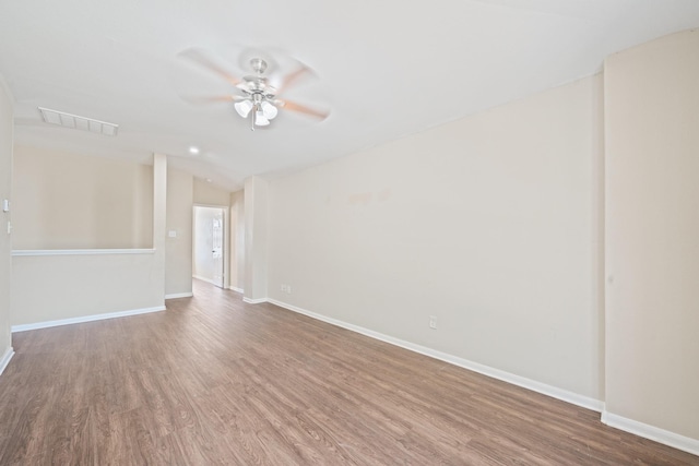 spare room with ceiling fan, lofted ceiling, and hardwood / wood-style flooring