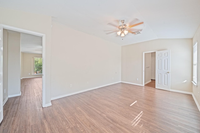 spare room featuring lofted ceiling, ceiling fan, and light hardwood / wood-style floors