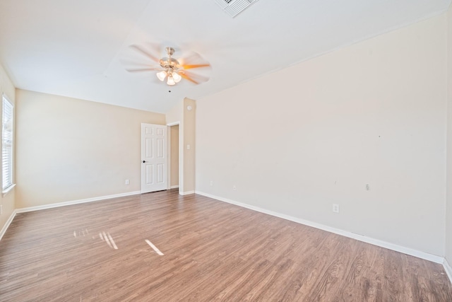 unfurnished room featuring vaulted ceiling, ceiling fan, and hardwood / wood-style flooring