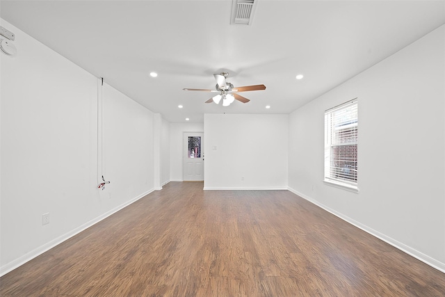 unfurnished room featuring ceiling fan and dark hardwood / wood-style floors