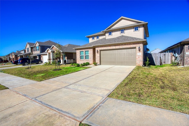 view of front of property with a front lawn and a garage