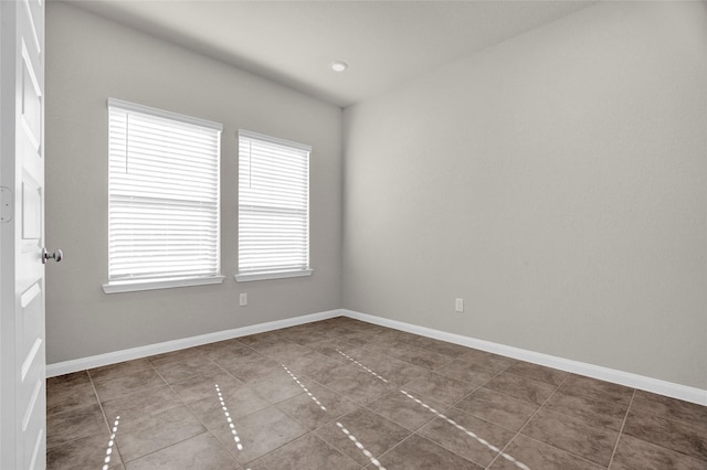 spare room with tile patterned flooring