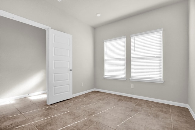 empty room with light tile patterned floors