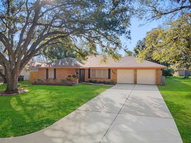 ranch-style home with a front yard and a garage