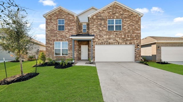 view of front of home with a garage and a front lawn