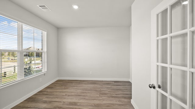 empty room featuring dark hardwood / wood-style flooring