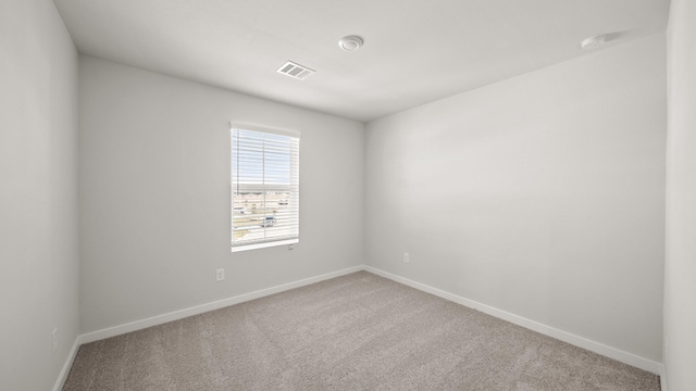 empty room with carpet flooring