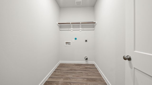 laundry room featuring electric dryer hookup, dark wood-type flooring, and hookup for a washing machine