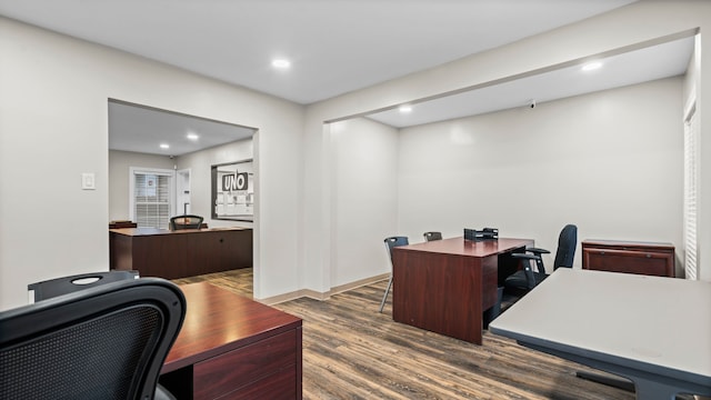 office with dark hardwood / wood-style floors