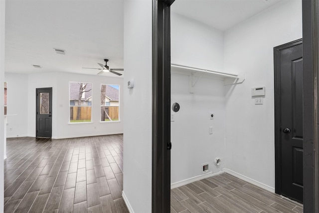 laundry room with laundry area, wood finish floors, visible vents, baseboards, and electric dryer hookup