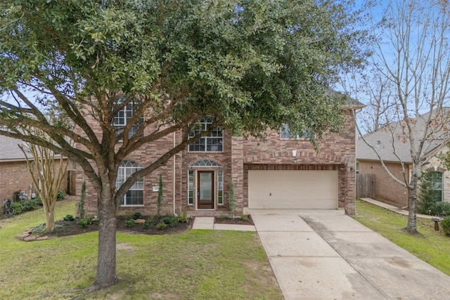 view of front facade with a garage, concrete driveway, brick siding, and a front yard