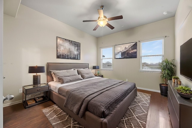 bedroom with dark wood-type flooring and ceiling fan