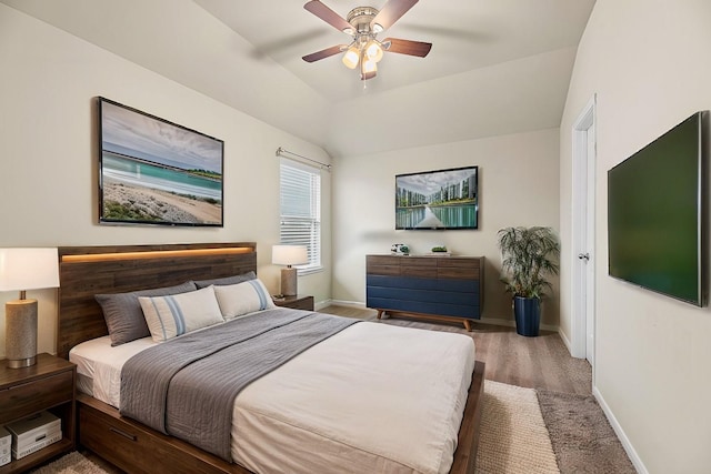 bedroom with lofted ceiling, hardwood / wood-style floors, and ceiling fan