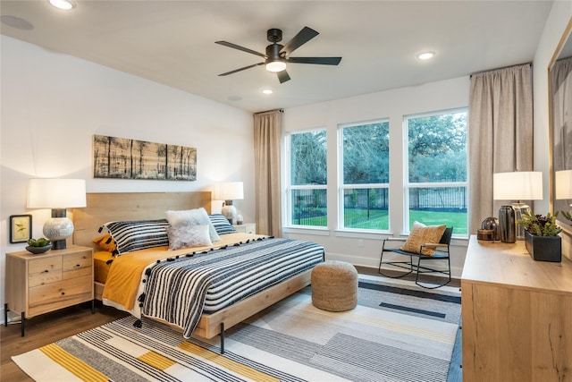 bedroom with dark wood-type flooring and ceiling fan