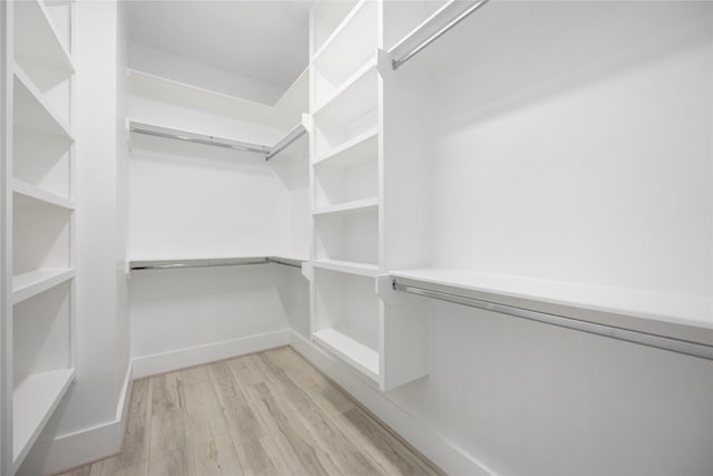 walk in closet featuring light wood-type flooring