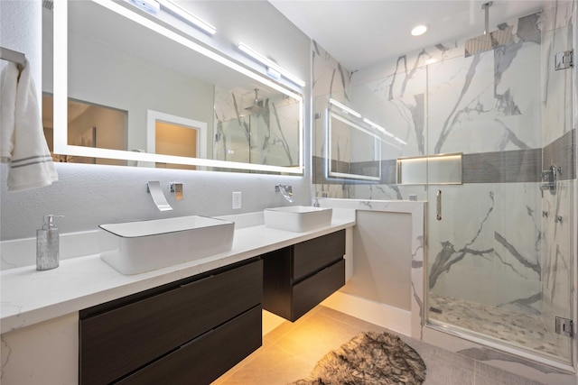 bathroom with vanity and a shower with shower door