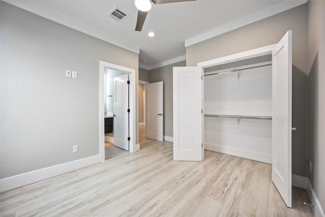 unfurnished bedroom with ceiling fan, light hardwood / wood-style flooring, a closet, and crown molding