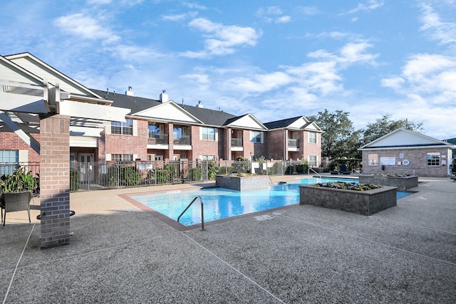 view of swimming pool featuring a patio