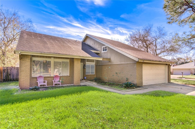 view of front of property featuring a garage and a front yard