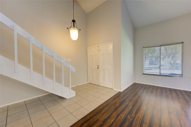 tiled entrance foyer with lofted ceiling