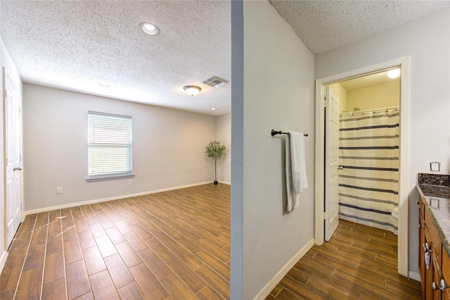 interior space with a textured ceiling