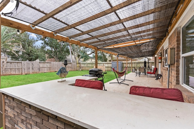 view of patio featuring a pergola and a storage shed