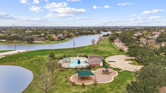 birds eye view of property with a water view