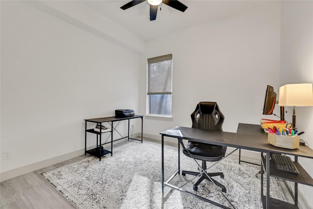 home office with ceiling fan and hardwood / wood-style flooring