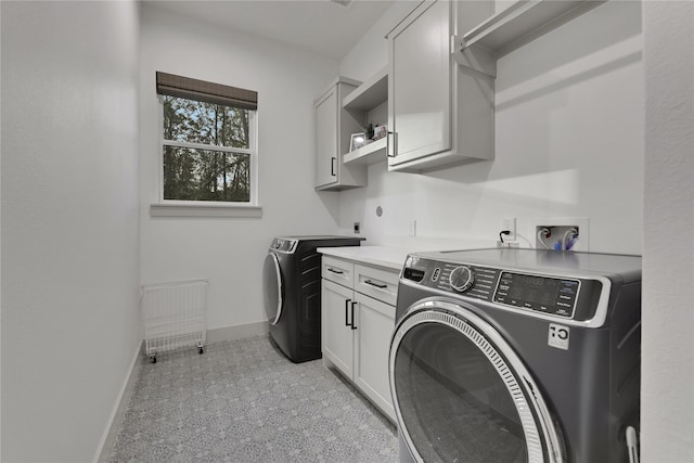 washroom with cabinets, separate washer and dryer, and radiator