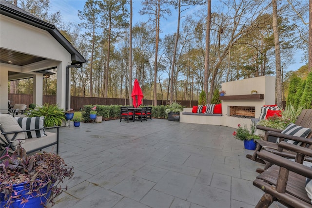 view of patio featuring exterior fireplace