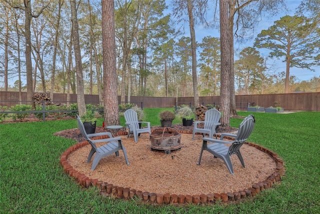 view of yard with an outdoor fire pit