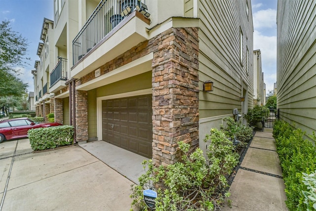 view of side of property with a garage