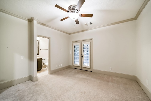 empty room with french doors, light carpet, ceiling fan, and crown molding