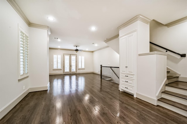 interior space with ornamental molding, ceiling fan, and dark hardwood / wood-style floors