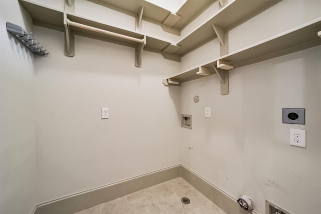 laundry room featuring gas dryer hookup, tile patterned flooring, electric dryer hookup, and washer hookup